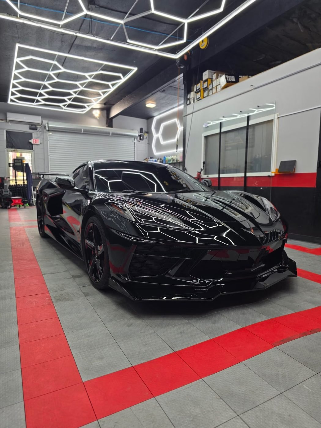 Black Corvette with ceramic coating under hex lights