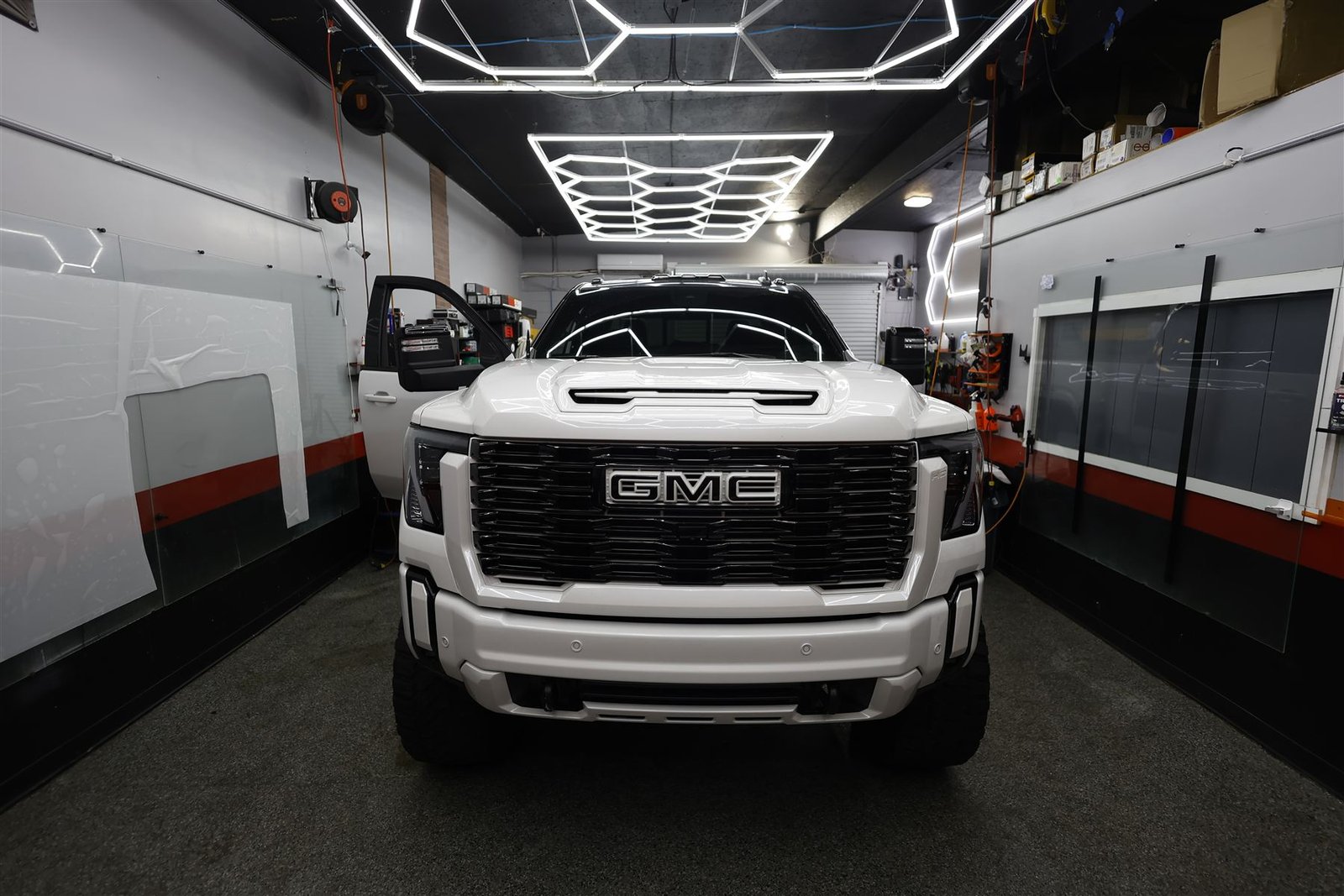 White GMC Sierra 2500 Denali after paint protection film in the shop