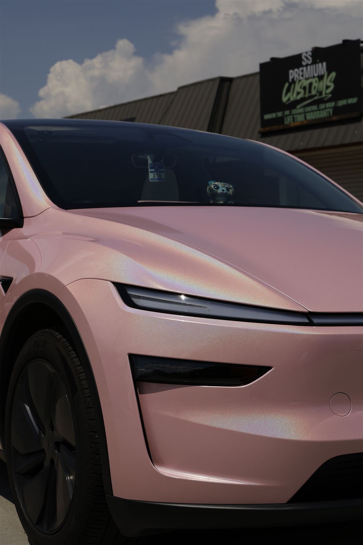 Tesla Model Y in iridescent pink color change